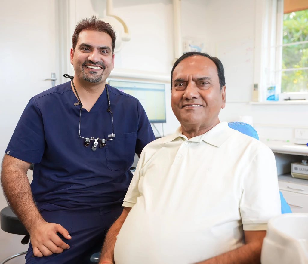 A dentist with a patient in the treatment room